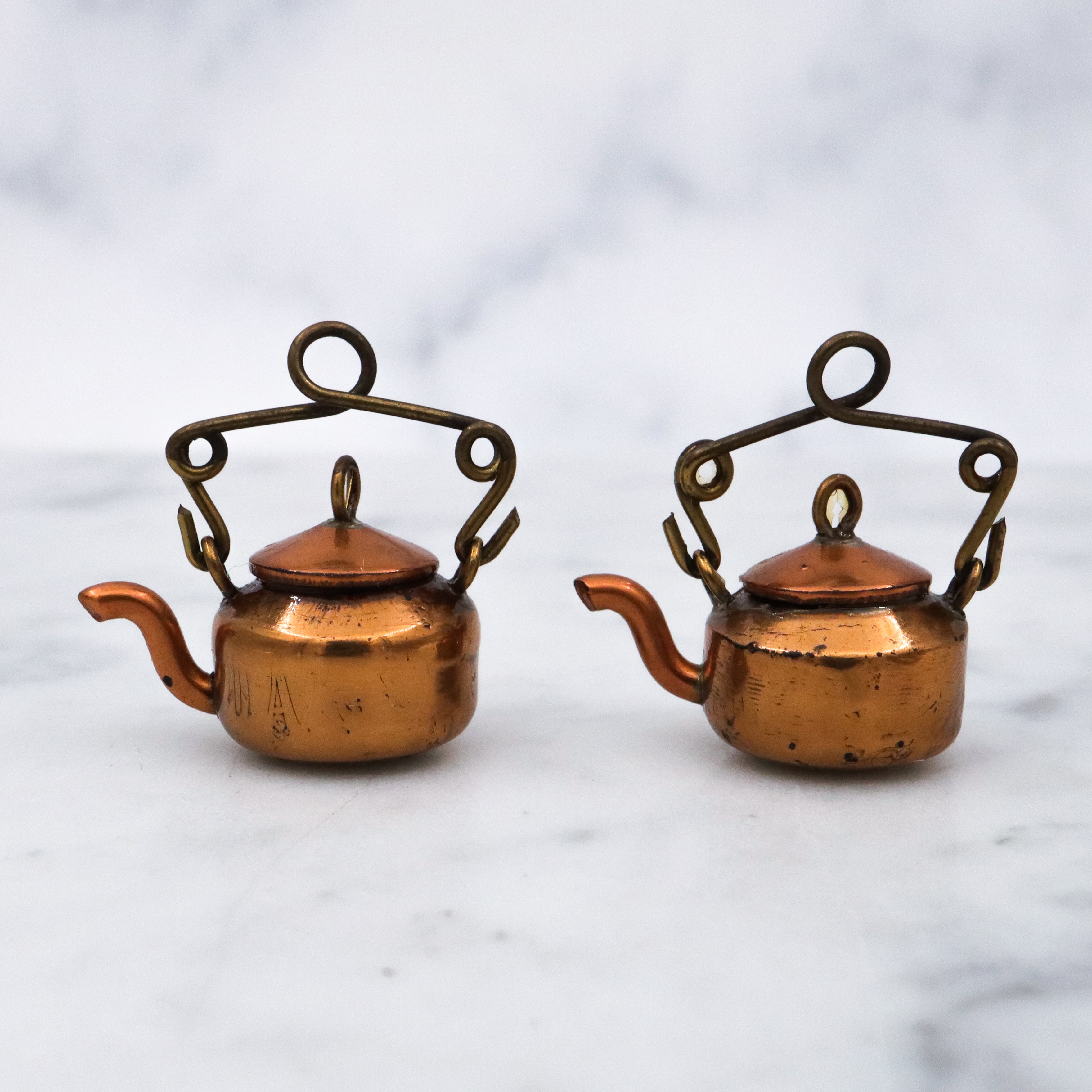 Pair of antique early 20th century prisoner made wheat penny copper tea kettles